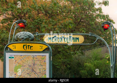 Ornate art deco or art nouveau Parisian metro sign with a map fragment at the Ile de la Cite stop near the Notre Dame de Paris cathedral in Paris Fran Stock Photo