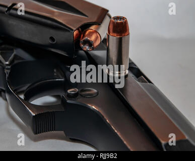 40 Caliber ammunition with magazine on black background Stock Photo - Alamy