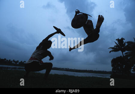 Caption: Kerala, India - May 2003. Kalaripayattu, the martial arts form of Kerala in the south of India.  A spiritual discipline, Kalaripayattu was de Stock Photo