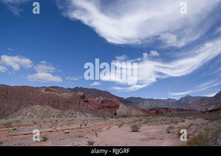 The striking beautiful desert landscape in northern Argentina near Salta and Juyjuy with red sandstone plateaus rivers and colorful hills