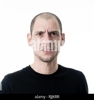 Close up portrait of young man with confused face thinking with a pensive expression looking Puzzled and doubtful. Isolated on white background, in Pe Stock Photo