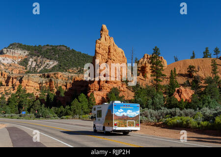 RV cruising through the Red Canyon on Utah State Route 12 in the Dixie National Forest in Utah, United States. Stock Photo