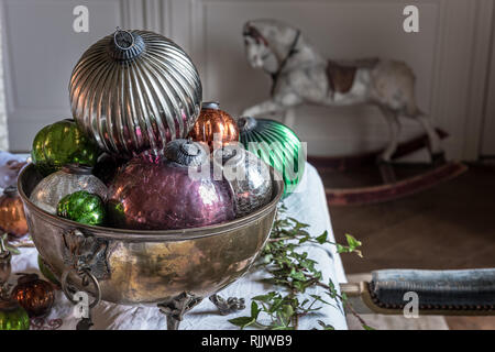 Large vintage baubles in silverware bowl Stock Photo