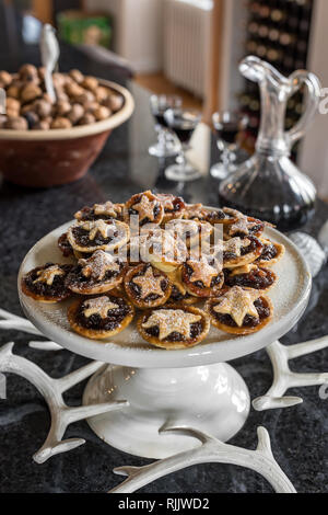 Home-made mince pies ready for Christmas with faux antlers by Cox & Cox Stock Photo