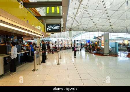 HONG KONG - MARCH 08, 2016: McCafe in the Airport. McCafe is a coffee-house-style food and drink chain, owned by McDonald's. Stock Photo