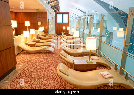 DUBAI, UAE - CIRCA APRIL, 2016: interior of Emirates business class lounge. Emirates is the largest airline in the Middle East. It is an airline based Stock Photo