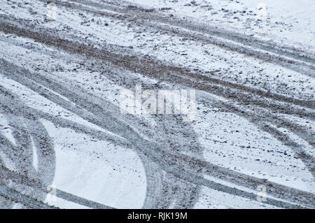 pattern of tires tracks in the snow Stock Photo