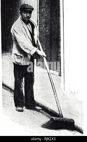 A photograph of a street sweeper cleaning the streets of London. Dated 20th century Stock Photo