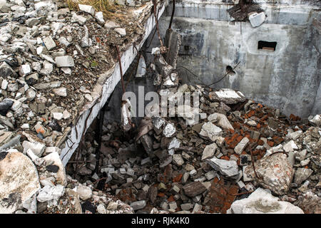 Blockage of bricks, pieces of concrete and other construction debris of the destroyed building. The view from the top. Background. Stock Photo