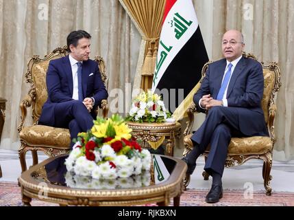 Baghdad, Iraq. 6th Feb, 2019. Italy's Prime Minister Giuseppe Conte (L) meets with Iraq's President Barham Salih in Baghdad, Iraq, on Feb. 6, 2019. Iraq's President Barham Salih on Wednesday said that Iraq is keen to establish effective relations with Italy and the European Union. Credit: Khalil Dawood/Xinhua/Alamy Live News Stock Photo