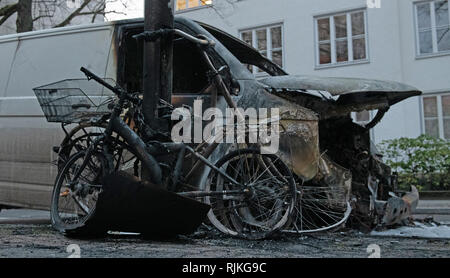 Berlin, Germany. 07th Feb, 2019. A burnt-out van, which was in use for the online retailer Amazon, stands on Sarrazinstraße. During the night, unknown perpetrators had set the vehicle on fire. The flames also spread to a car parked in front of the van. Two bicycles were also destroyed. Credit: Paul Zinken/dpa/Alamy Live News Stock Photo
