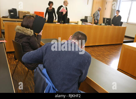 Augsburg, Germany. 07th Feb, 2019. A 39-year-old man is sitting next to a 50-year-old woman in the dock at the Criminal Justice Centre. The two responsible persons of a children's cancer aid association are accused of fraud and infidelity. They are said to have kept more than 150000 Euro in donations for themselves. Credit: Karl-Josef Hildenbrand/dpa/Alamy Live News Stock Photo
