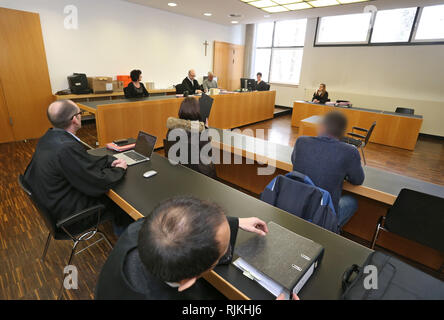 Augsburg, Germany. 07th Feb, 2019. A 39-year-old man sits in the criminal justice centre next to a 50-year-old woman in front of two lawyers in the dock. The two responsible persons of a children's cancer aid association are accused of fraud and infidelity. They are said to have kept more than 150000 Euro in donations for themselves. Credit: Karl-Josef Hildenbrand/dpa - ATTENTION: person(s) was/are pixelated for legal reasons/dpa/Alamy Live News Stock Photo