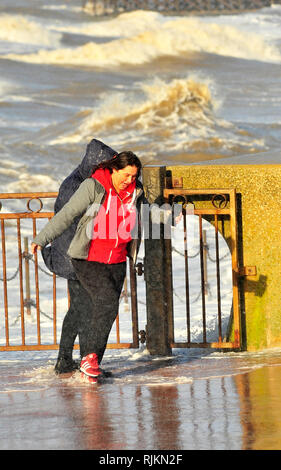 Blackpool, UK. 7th February 2019. A combination of strong winds and a high tide produced spectacular seas at Blackpool. Two young women got too close to the waves with their mobile phones and had to bid a quick retreat after getting a good soaking (3 pics). Kev Walsh/Alamy live news Credit: kevin walsh/Alamy Live News Stock Photo