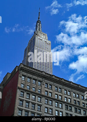 NEW YORK CITY - JUNE 2012:  The Empire State Building, dominates the midtown skyline, and is surrounded by other interesting old office buildings. Stock Photo
