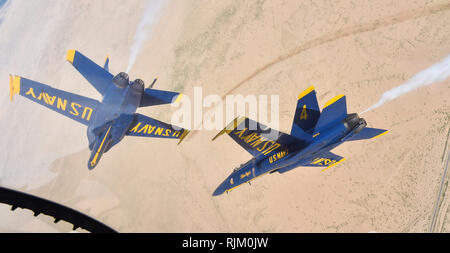 EL CENTRO, Calif. (Feb. 4, 2019) The U.S. Navy Flight Demonstration Squadron, the Blue Angels, diamond pilots perform the diamond roll maneuver over the Imperial Valley during a training flight. The Blue Angels are conducting winter training at Naval Air Facility El Centro, California, in preparation for the 2019 show season. The team is scheduled to conduct 61 flight demonstrations at 32 locations across the country to showcase the pride and professionalism of the U.S. Navy and Marine Corps to the American public. U.S. Navy photo by Mass Communication Specialist 1st Class Ian Cotter (Released Stock Photo