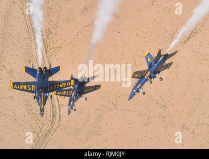 EL CENTRO, Calif. (Feb. 4, 2019) The U.S. Navy Flight Demonstration Squadron, the Blue Angels, diamond pilots perform the diamond dirty roll maneuver over the Imperial Valley during a training flight. The Blue Angels are conducting winter training at Naval Air Facility El Centro, California, in preparation for the 2019 show season. The team is scheduled to conduct 61 flight demonstrations at 32 locations across the country to showcase the pride and professionalism of the U.S. Navy and Marine Corps to the American public. U.S. Navy photo by Mass Communication Specialist 1st Class Ian Cotter (Re Stock Photo