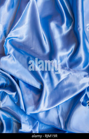 Light blue lacy underwear on shiny white silky fabric Stock Photo - Alamy