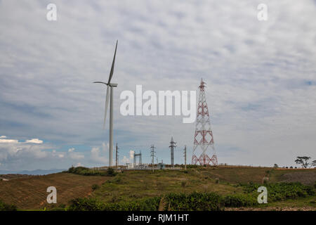 Wind turbine with high power tower and high voltage sub station on the mountain. Stock Photo
