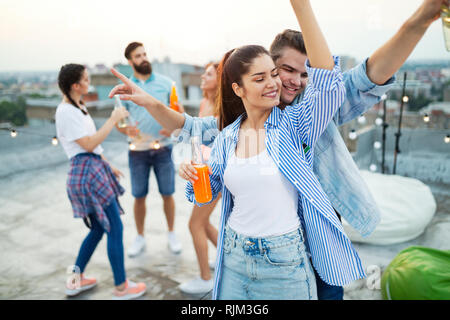 Happy lovely couple having fun time at party Stock Photo
