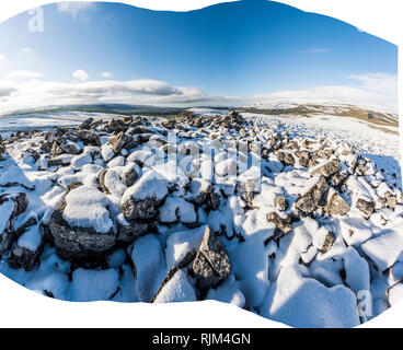 Panoramic snow covered winter landscape from Smearsett Scarr in the Yorkshire Dales looking towards Ingleborough and the Lake District Stock Photo