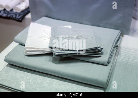 Tablecloths over table. Wooden table covered with tablecloth. Top view texture square. Unique perspectives. Empty tablecloth for mock up, template pro Stock Photo