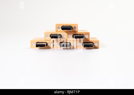 Stack of wooden pendrive memory usb isolated on white background. Stock Photo