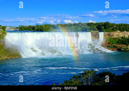 View of the American side of Niagara Falls with beautiful rainbow Stock Photo