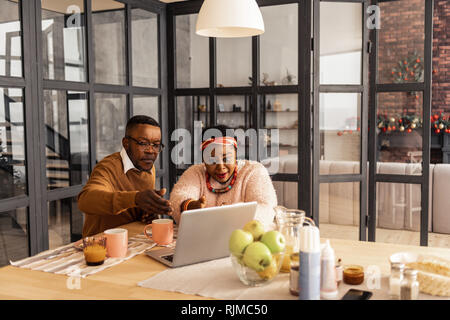 Nice married couple making a video call Stock Photo