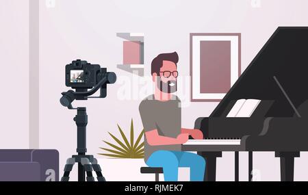 guy musical blogger recording video on camera man playing classical piano music blog concept modern apartment interior closeup horizontal Stock Vector