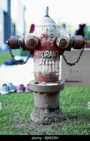 Old Red fire hydran outside building Stock Photo