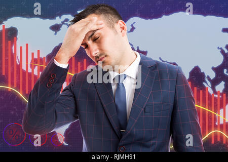 Male broker with headache caused by stress as economic decline concept on world map and red graph background Stock Photo