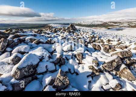 Winter landscape with snow covered scenery from Smearsett Scar in the Yorkshire Dales looking north towards Ingleborough and the Lake District Stock Photo