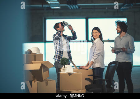 young team of business people in group, architect and engineer on construction site checking documents and business workflow using the virtual reality Stock Photo