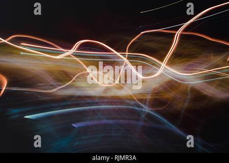 Abstract background of blurred exposure light lines in darkness representing fast fiber optic internet communication and Ai Stock Photo