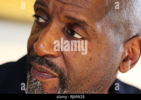 Micro artist Willard Wigan MBE who makes sculptures which fit within the eye of a needle, pictured at his exhibition in Broadway, Worcestershire. Stock Photo