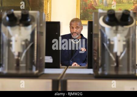 Micro artist Willard Wigan MBE who makes sculptures which fit within the eye of a needle, pictured at his exhibition in Broadway, Worcestershire. Stock Photo