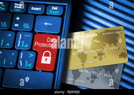 Close up of computer laptop keyboard on generic credit cards with red button Data Protection concept and copy space. Idea of Internet security, data p Stock Photo