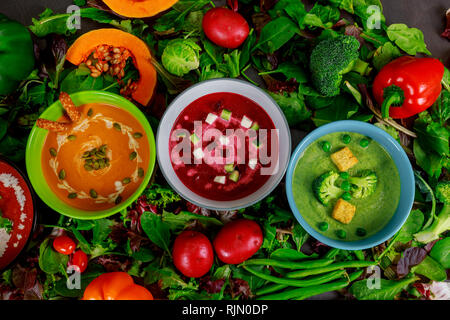 Different set vegetable cream multi colored soups top view Stock Photo
