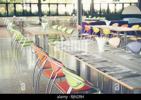 Tables and chairs empty in canteen Stock Photo