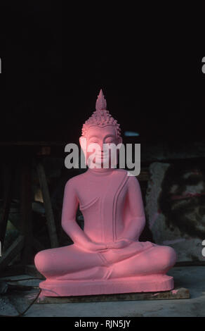 Caption: Luang Prabang, Laos - Sep 2002. A Buddha statue fresh from its cast, primed and waiting for the finishing touches in Luang Prabang, Laos.     Stock Photo