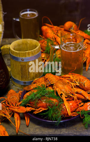 Beer with crayfish near the wooden barrel. Oktoberfest. Stock Photo