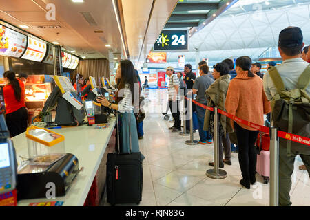 HONG KONG - MARCH 08, 2016: McDonald's restaurant in the Airport. McDonald's primarily sells hamburgers, cheeseburgers, chicken, french fries, breakfa Stock Photo