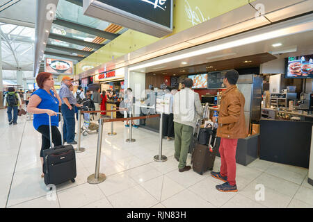 HONG KONG - MARCH 08, 2016: McCafe in the Airport. McCafe is a coffee-house-style food and drink chain, owned by McDonald's. Stock Photo