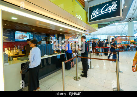 HONG KONG - MARCH 08, 2016: McCafe in the Airport. McCafe is a coffee-house-style food and drink chain, owned by McDonald's. Stock Photo