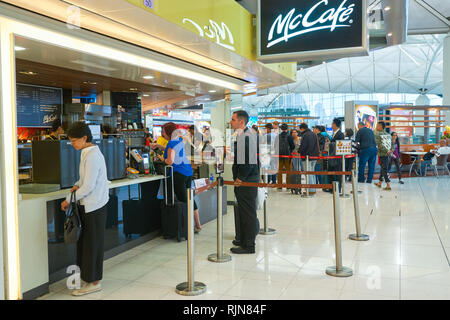 HONG KONG - MARCH 08, 2016: McCafe in the Airport. McCafe is a coffee-house-style food and drink chain, owned by McDonald's. Stock Photo