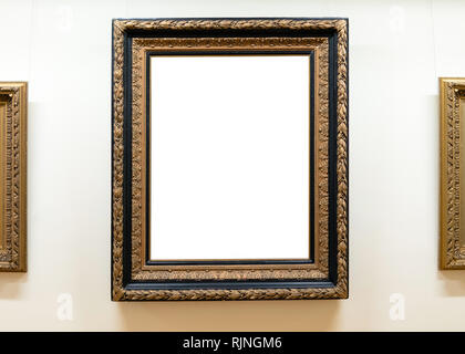 Blank empty frames hanging on museum wall. Art gallery, museum exhibition white clipping path Stock Photo