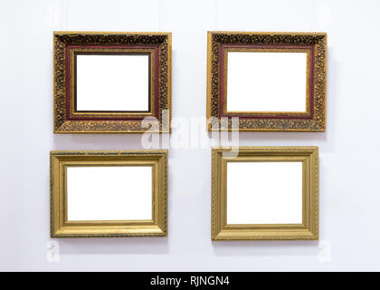 Blank empty frames hanging on museum wall. Art gallery, museum exhibition white clipping path Stock Photo