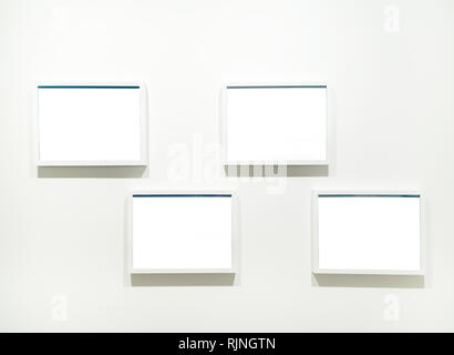 Empty Frames on the wall in modern art museum Gallery Exhibit Blank White Isolated Clipping Path Stock Photo