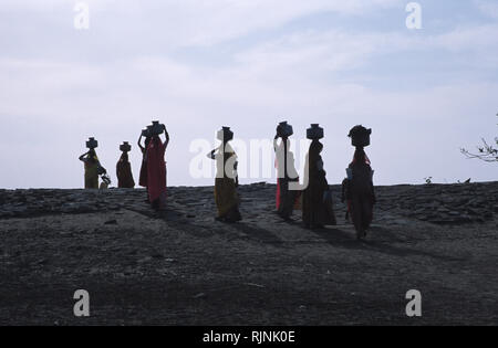 india women carrying jars on their head  vector